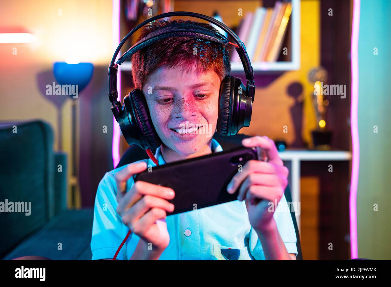 Happy kid boy gamer imagine winning real battle while playing video game on  pc computer. Funny child cartoon character of little boy wearing  headphones. Virtual gaming concept. 3D render Stock Photo by ©