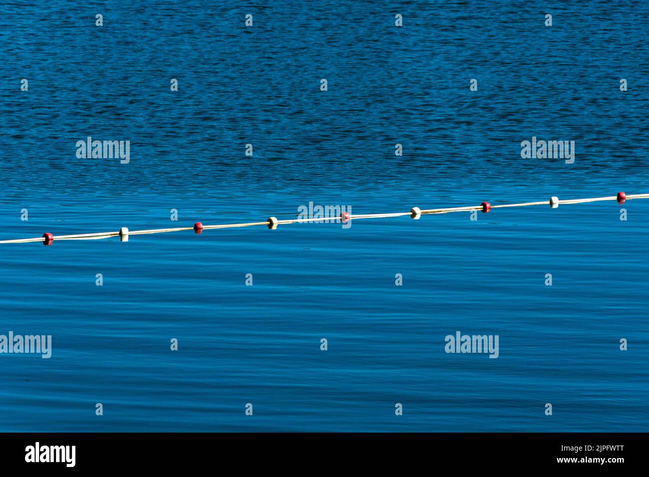 Closeup shot of fencing buoys in the sea on daytime Stock Photo