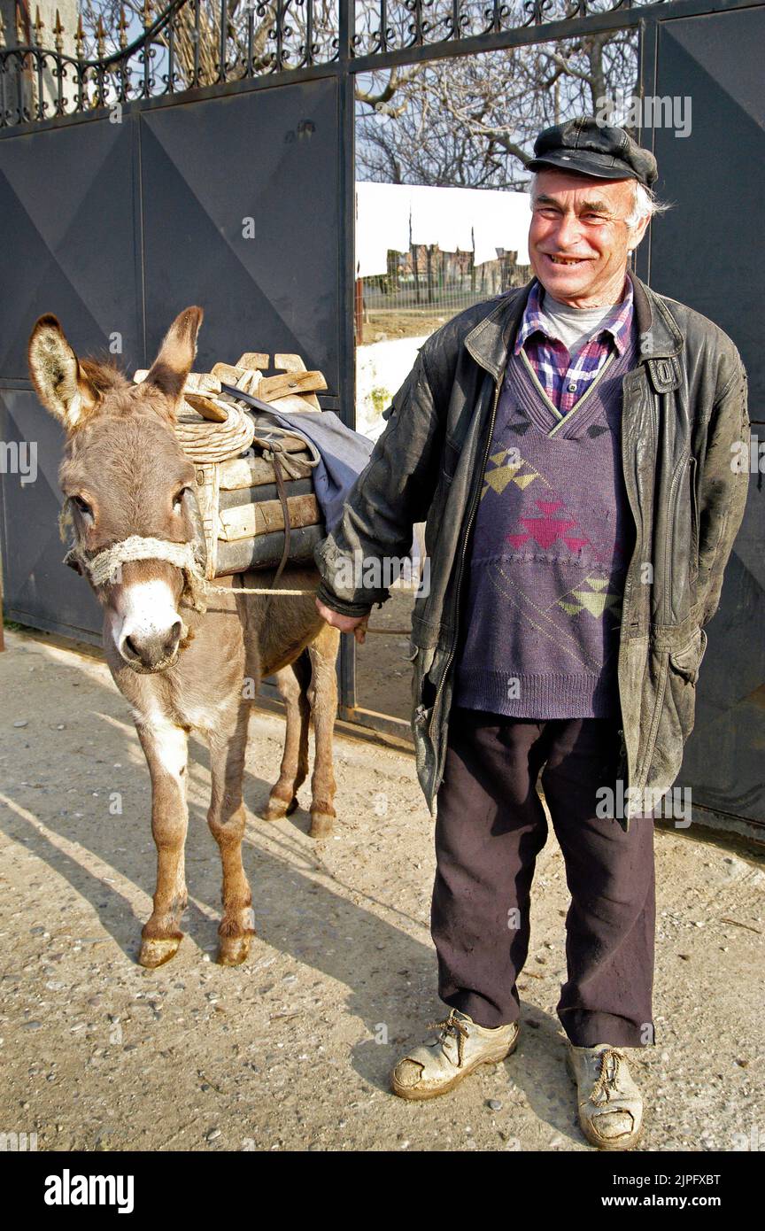 Albanian peasant and donkey, rural Albania Stock Photo