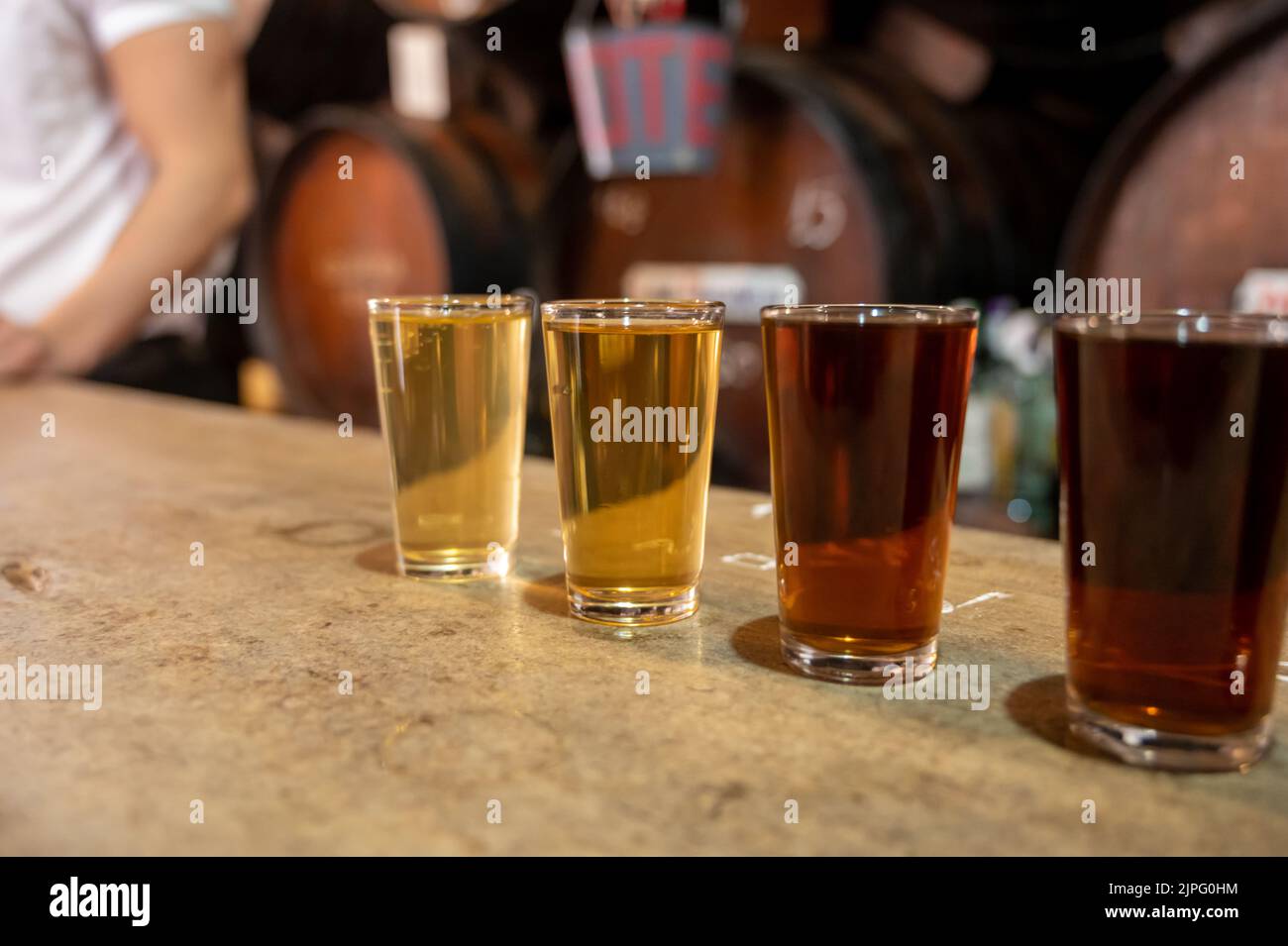 Tasting of different sweet wines from wooden barrels on old bodega wine