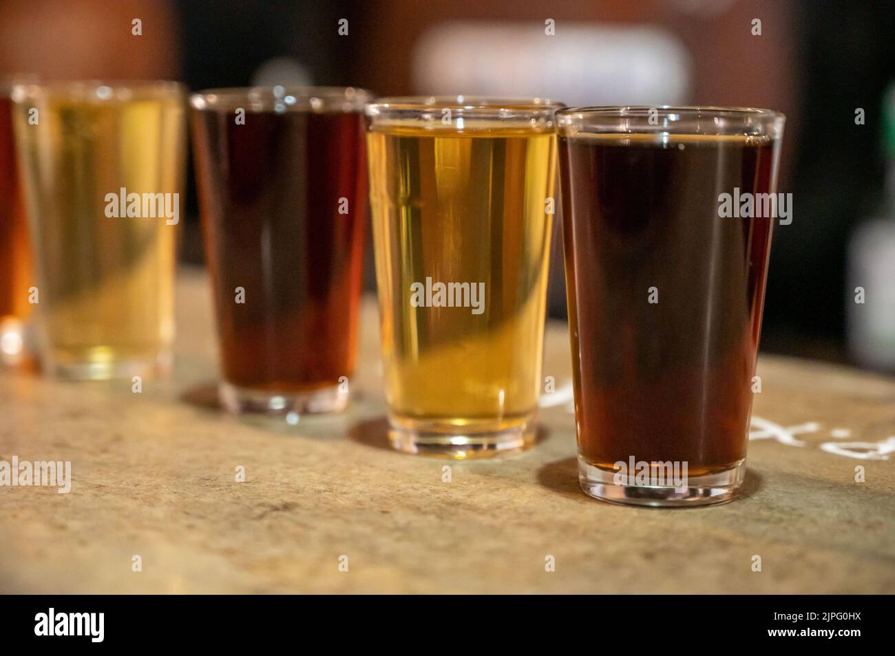 Tasting of different sweet wines from wooden barrels on old bodega wine