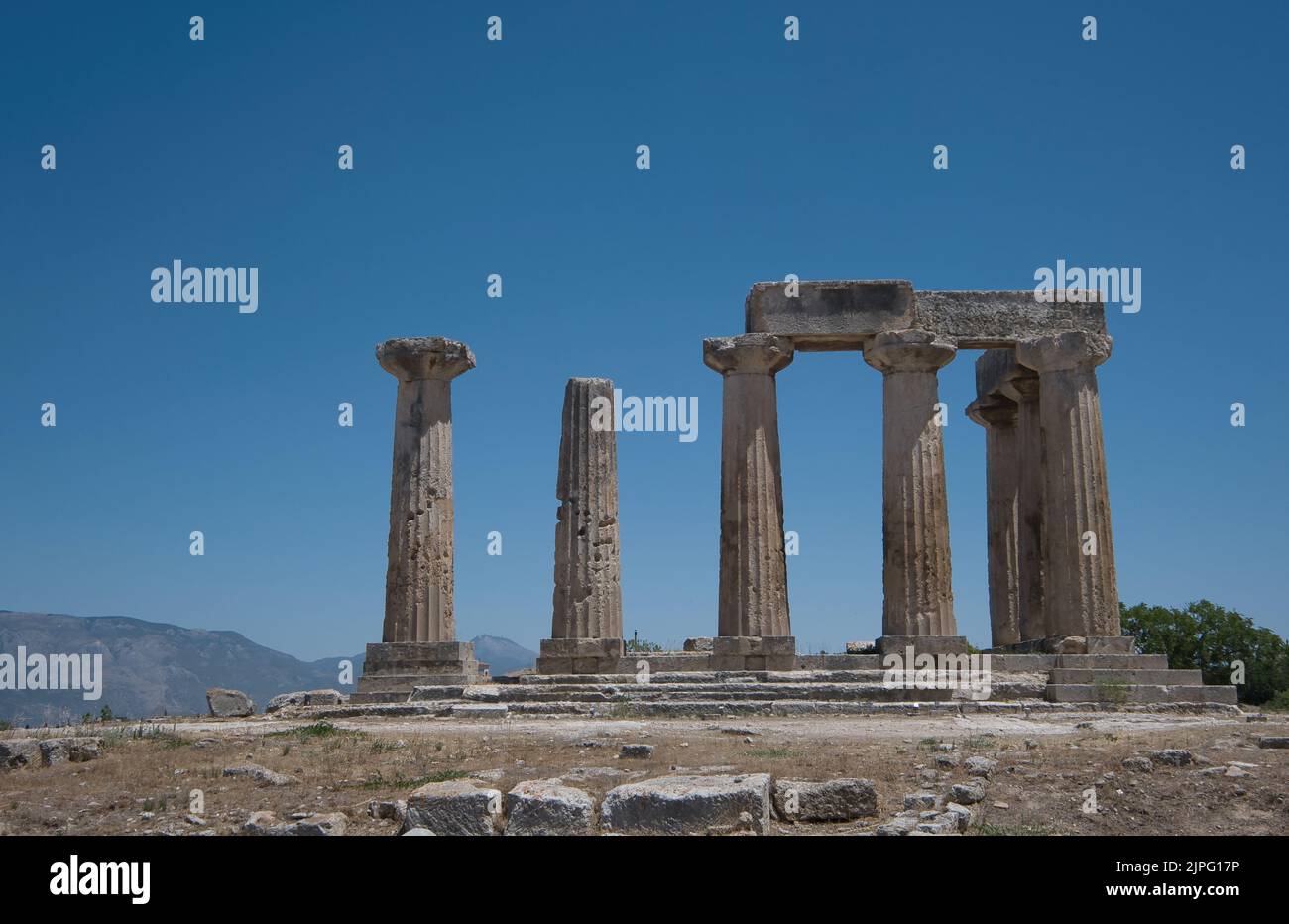 View of the Temple of Apollo in Ancient Corinth, Greece in summer Stock Photo