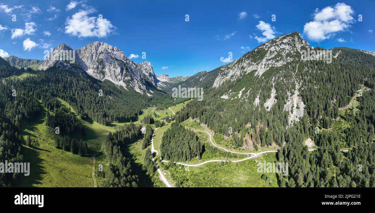 tyrolean alps with soil with the managed hut musauer alm in the middle of green forest and meadows Stock Photo