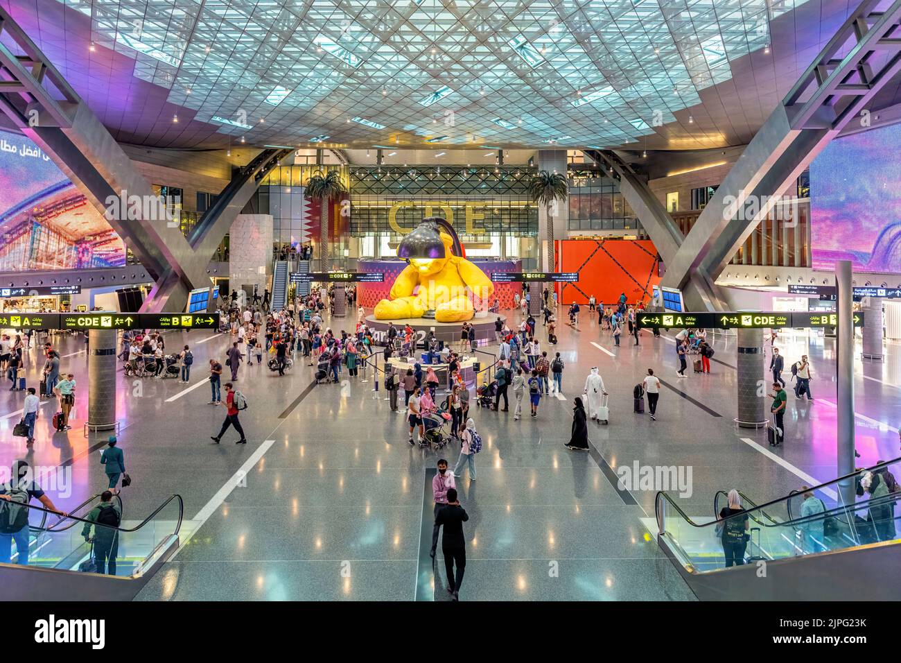 Hamad Terminal Interior of Hamad International Airport Terminal full of Tourist People ...