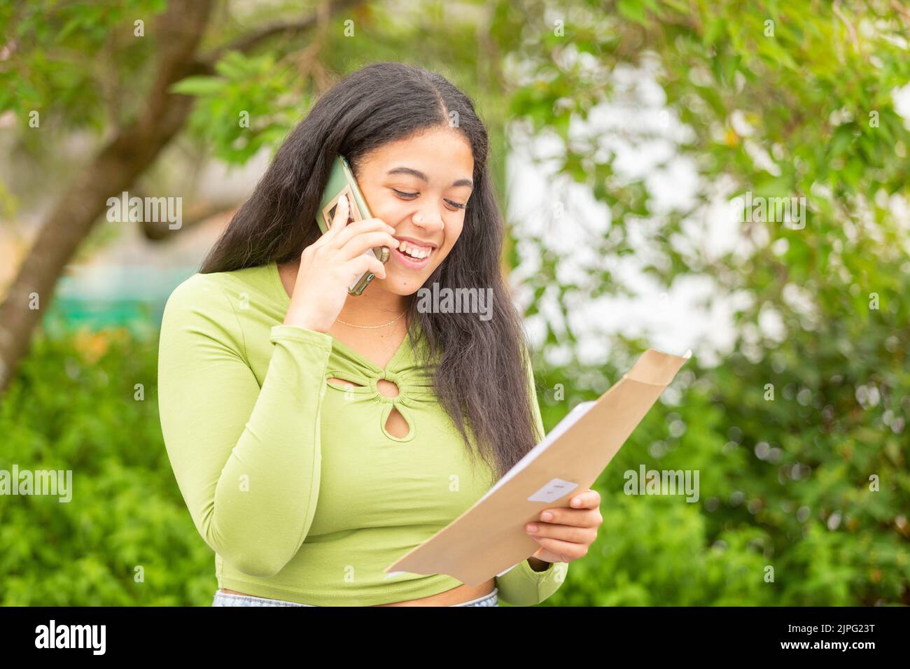 Bewdley, Worcestershire, UK. 18th Aug, 2022. Latisha Cope of Bewdley Sixth Form, Worcestershire, tells her parents the good news of her A Level exam results. Credit: Peter Lopeman/Alamy Live News Stock Photo