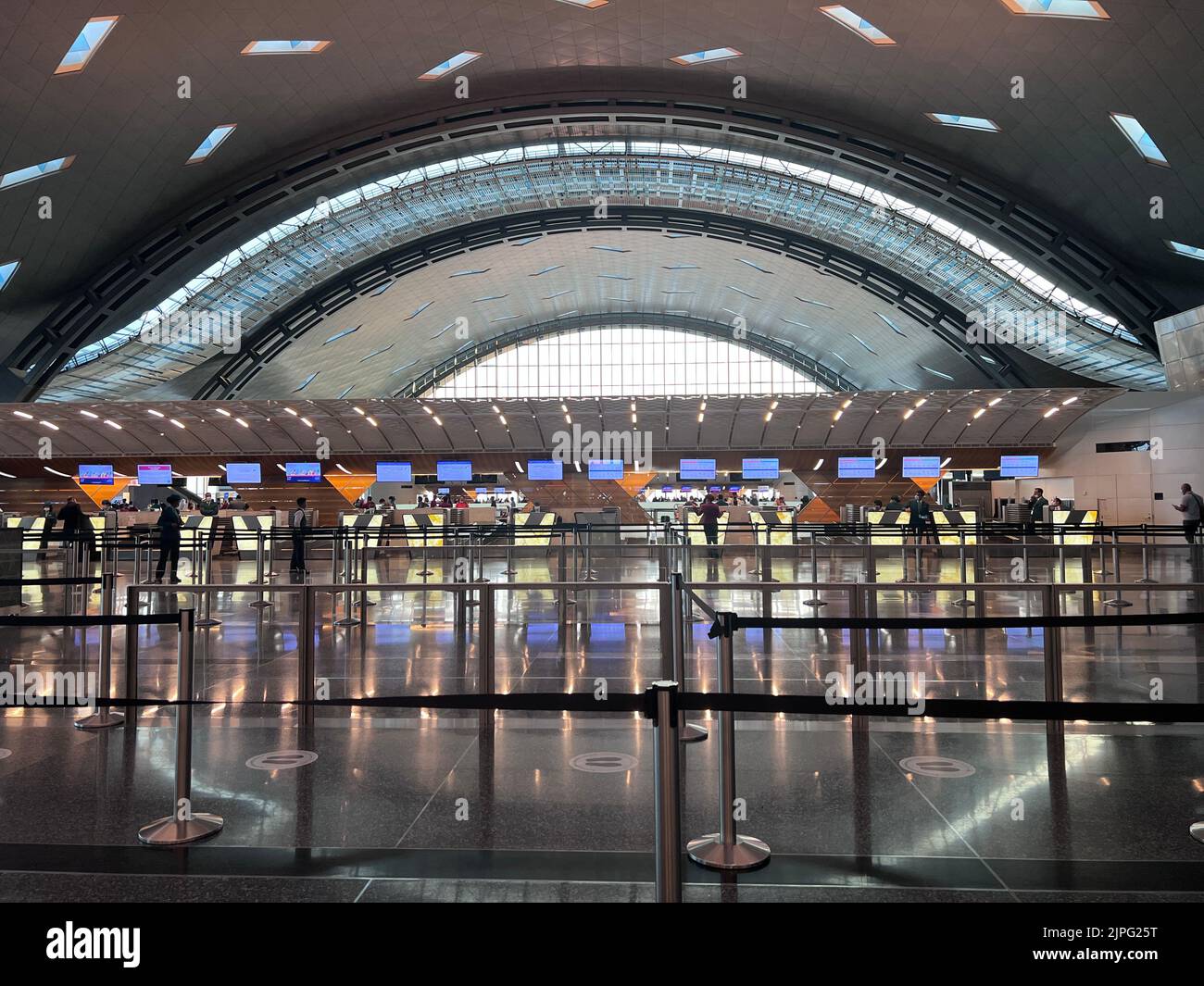 Hamad Terminal Interior of Hamad International Airport Terminal full of Tourist People ...