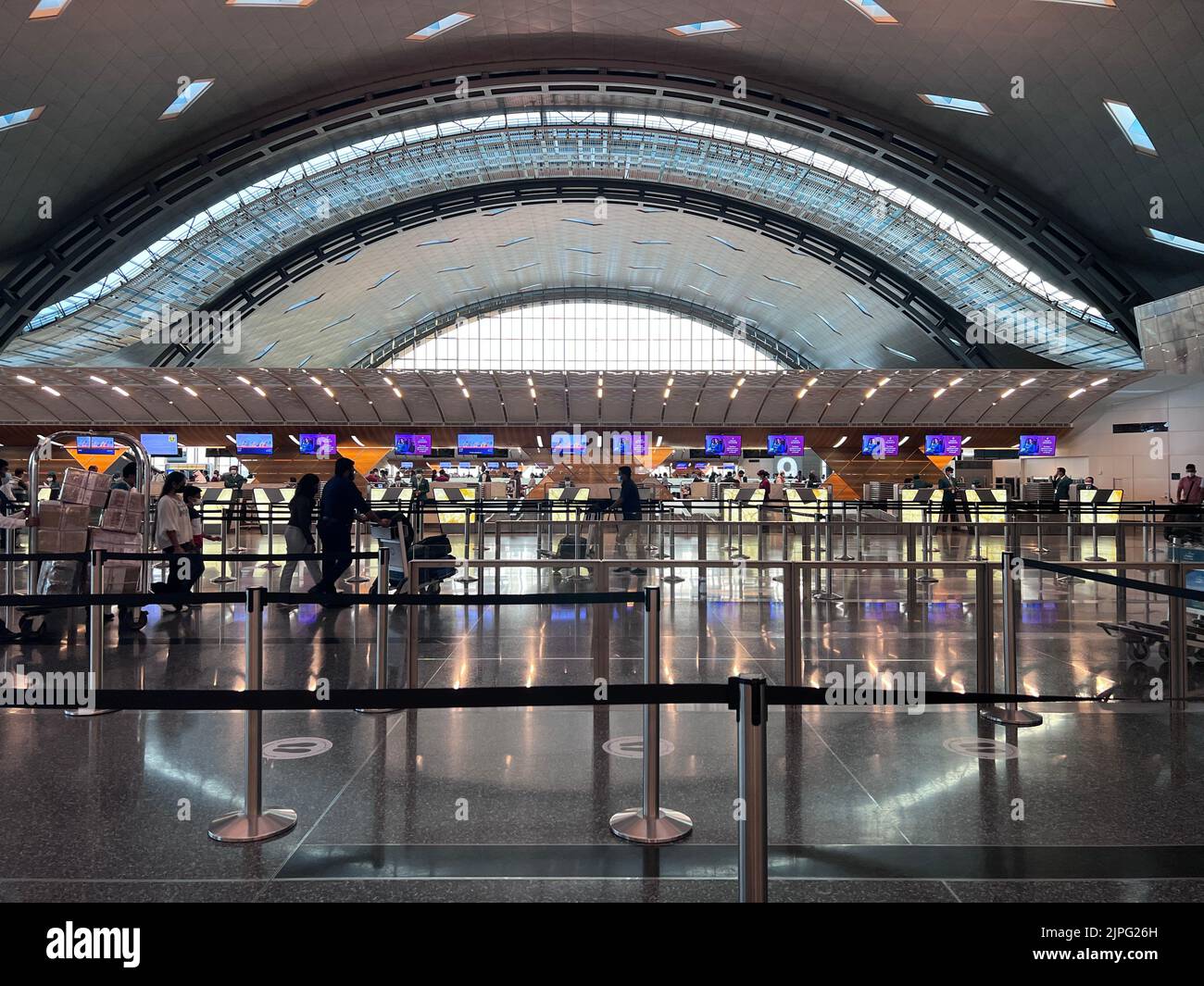 Hamad Terminal Interior of Hamad International Airport Terminal full of Tourist People ...