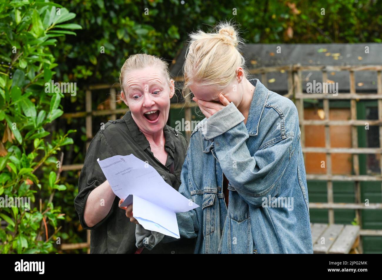 Lewes UK 18th August 2020 - Mother and daughter pupil opens her A Level results at Lewes Old Grammar School in East Sussex today .  : Credit Simon Dack / Vervate / Alamy Live News Stock Photo