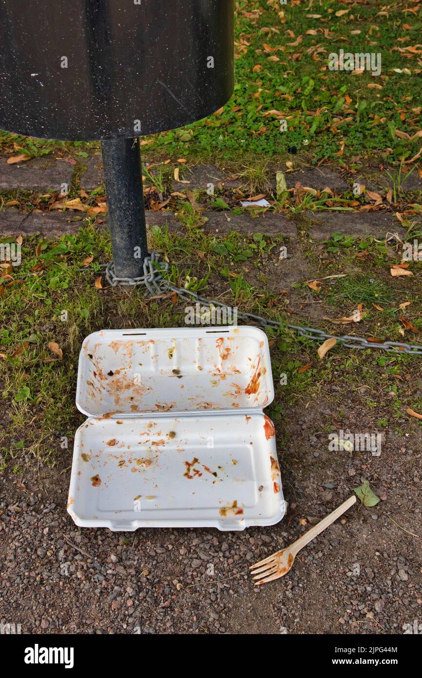 fast food polystyrene box on ground outdoors Stock Photo