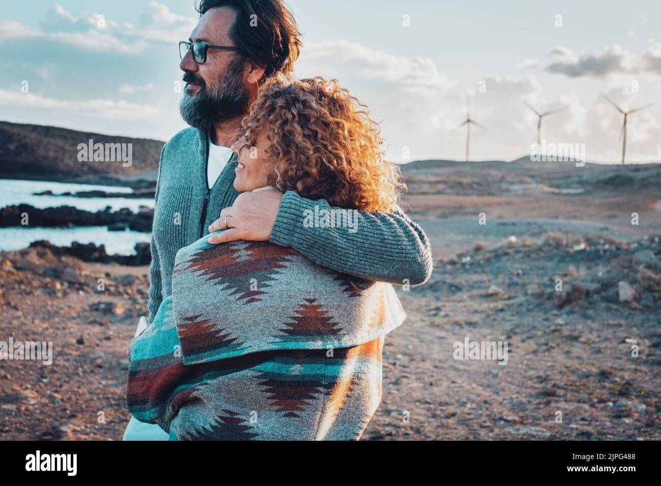 Romantic people man and woman hugging and admiring beautiful landscape ...