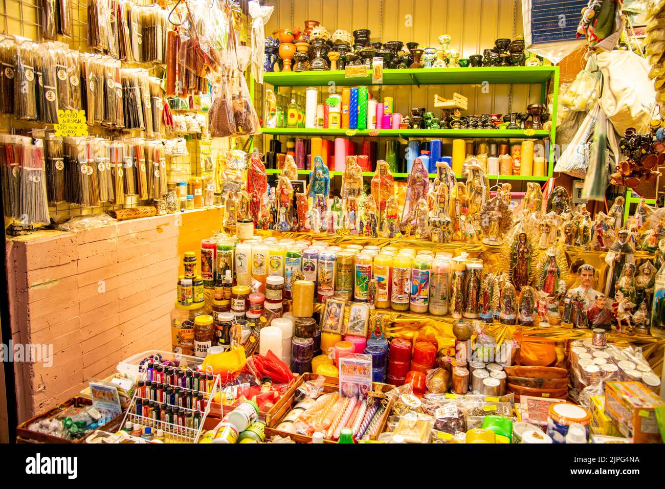 Candles, lighters, incense and ornaments being sold at Coyoacan Market in Mexico City, Mexico Stock Photo