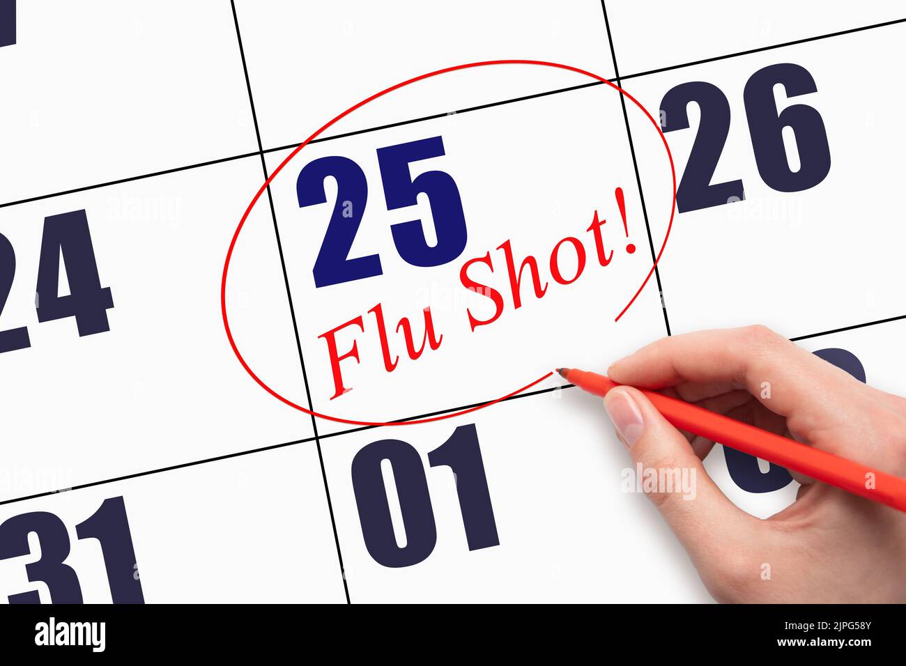 25th day of the month.  Hand writing text FLU SHOT and circling the calendar date. Mark the date on the day planner to have a flu shot. Healthcare Med Stock Photo