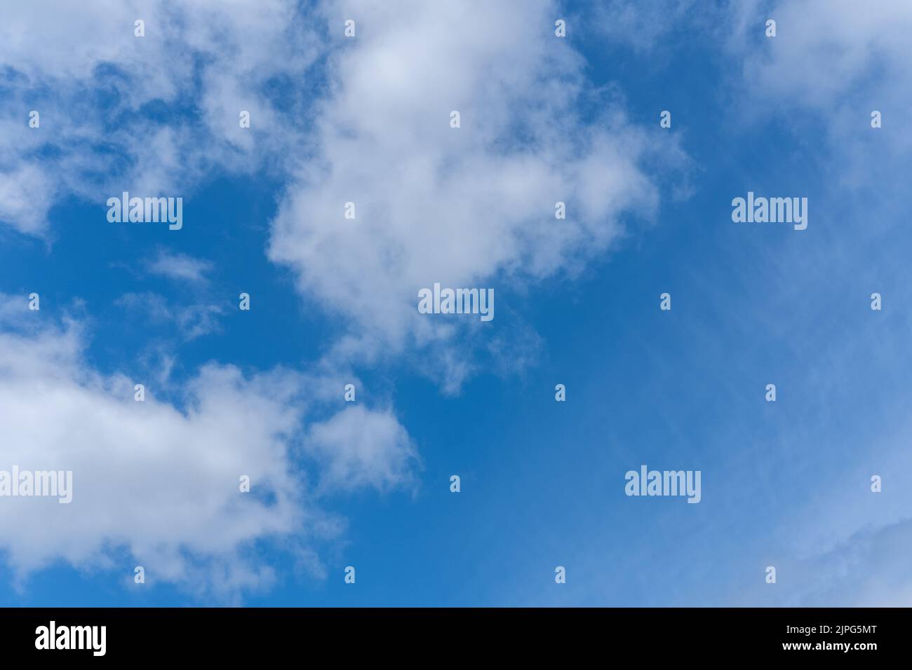 Blue sky background with white fluffy cumulus clouds. Panorama of white ...