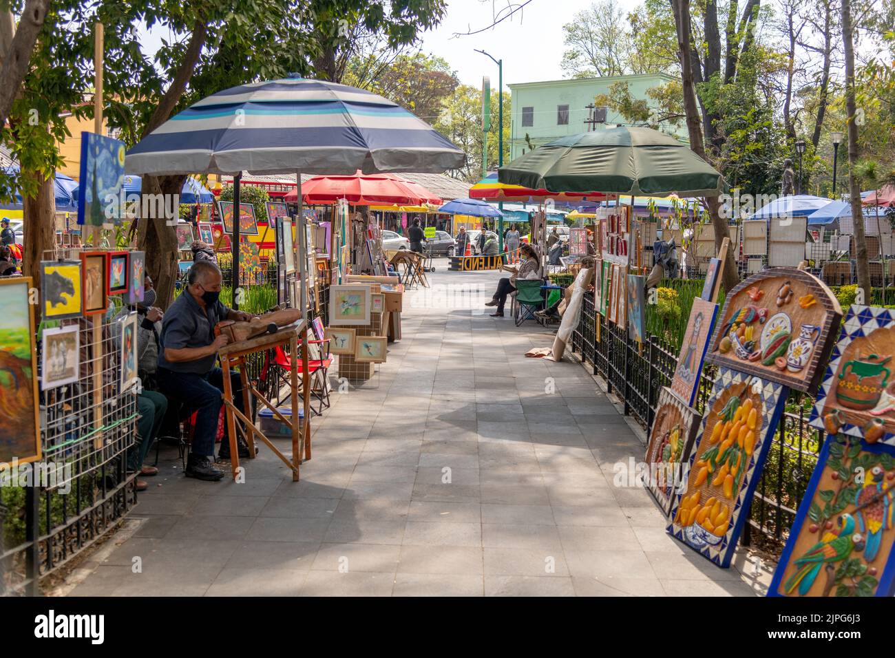 Painters and artists selling their artwork in a park in Coyoacan, Mexico City, Mexico Stock Photo