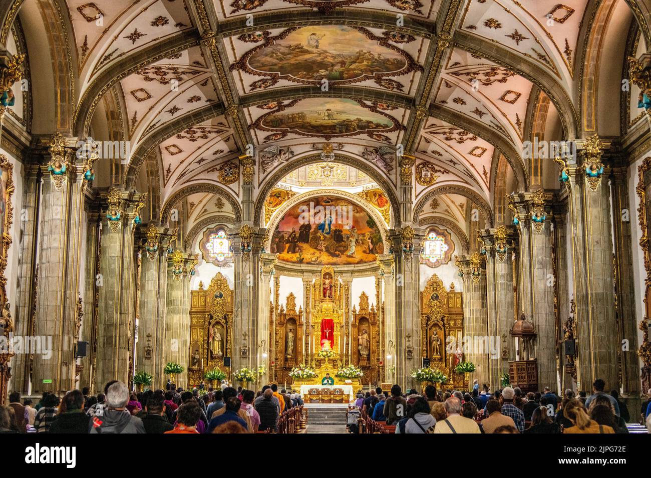 A service taking place inside Parroquia San Juan Bautista in Coyoacan, Mexico City, Mexico Stock Photo