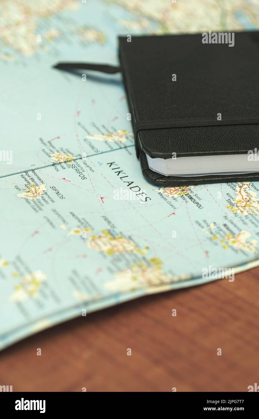 notebook on greek islands map Stock Photo