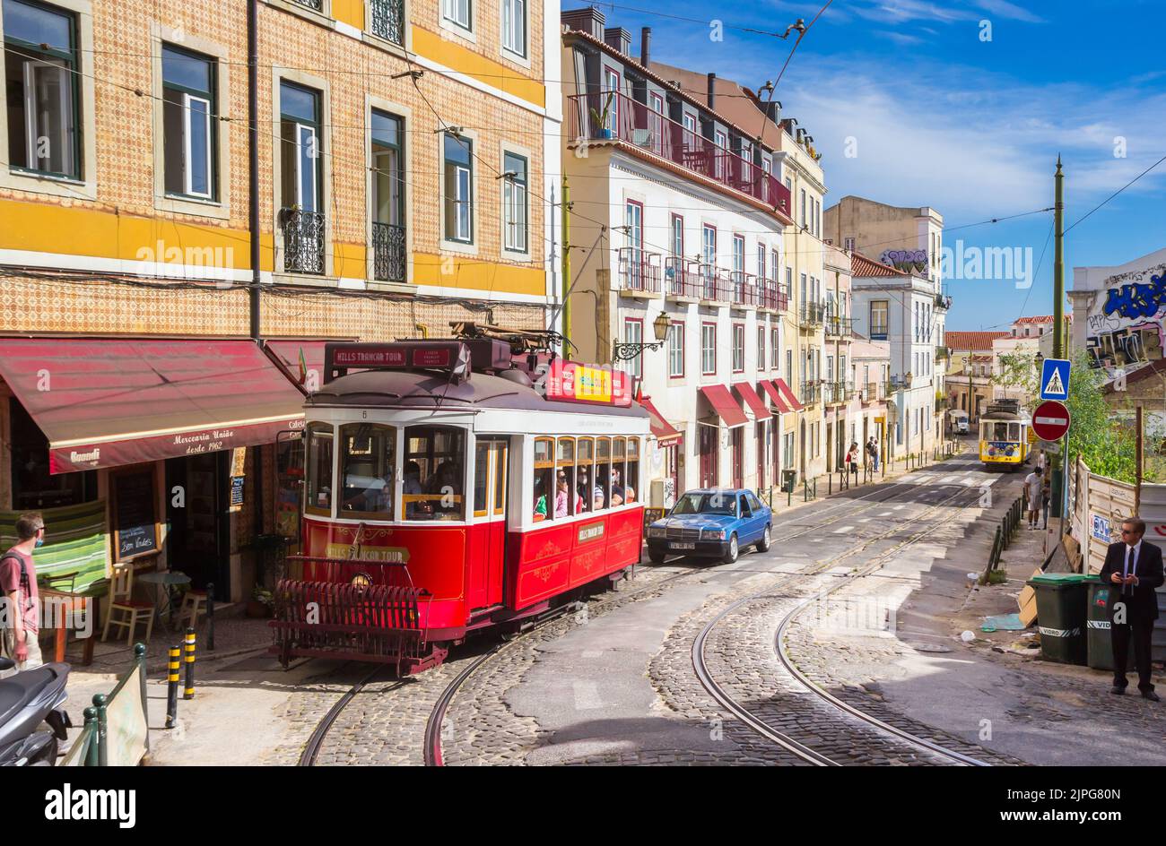 Two traditional trams going up and down the hill in Lisbon, Portugal Stock Photo