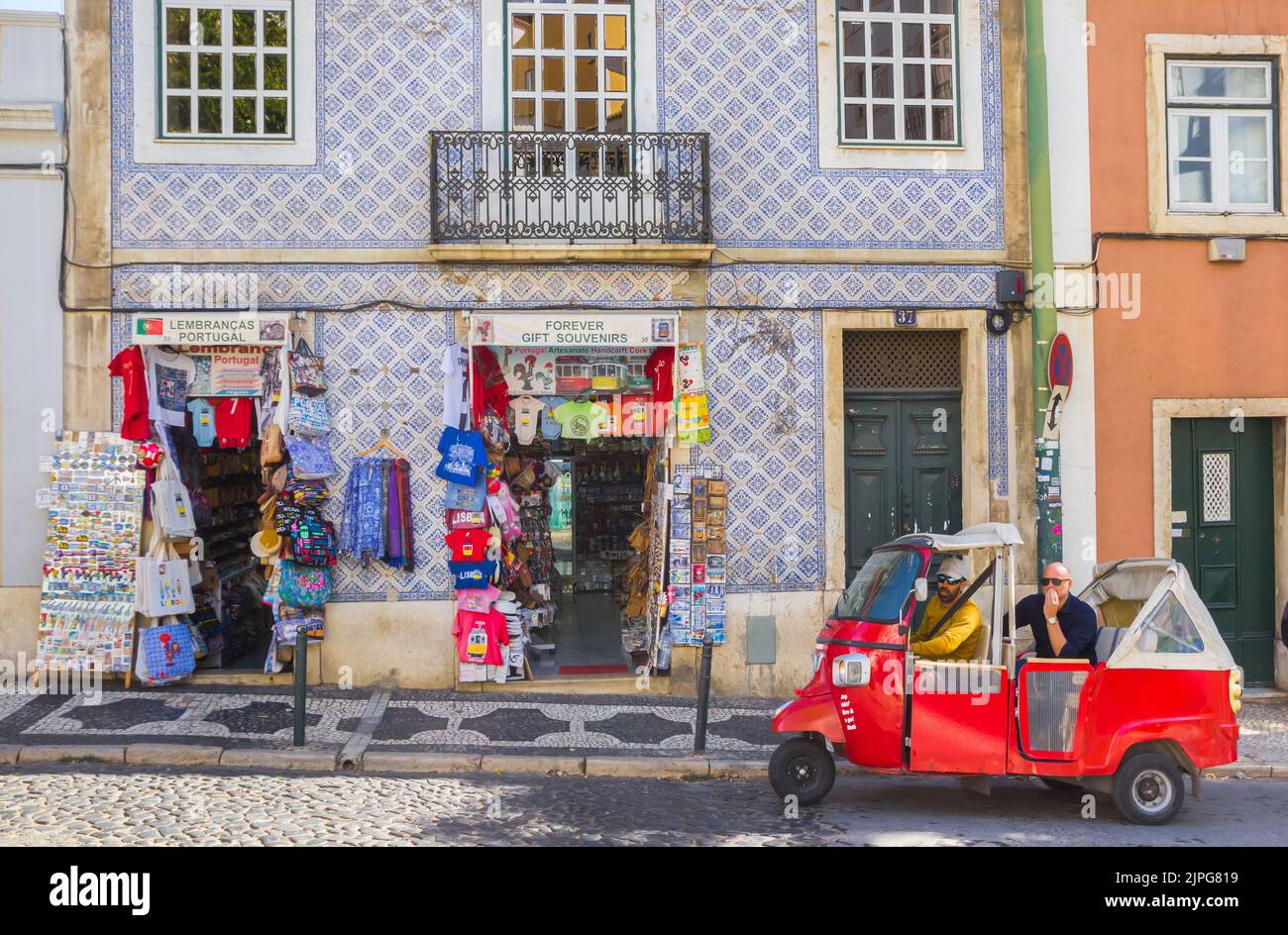 Tuk-tuk in front of a souvenir shop in Lisbon, Portugal Stock Photo