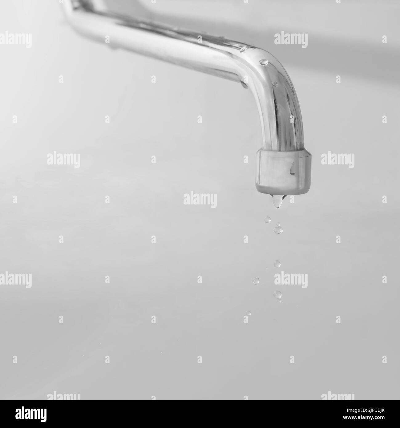 Water flowing from the faucet. Water leaking, saving concept. Stock Photo