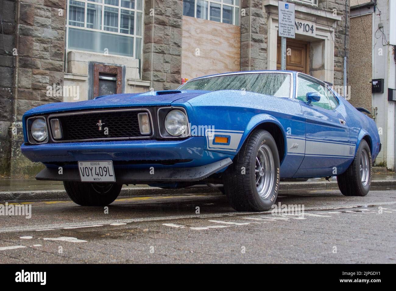 A Ford Mustang Mach 1 classic muscle car on a rainy day. Stock Photo