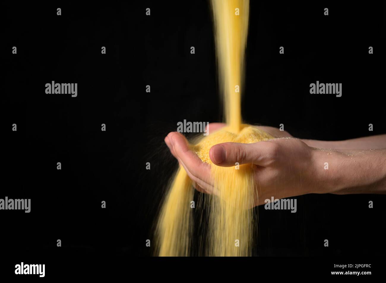 Abstract Farmer Sprinkles Corn Flour Dust Powder Through Hands Stock Photo