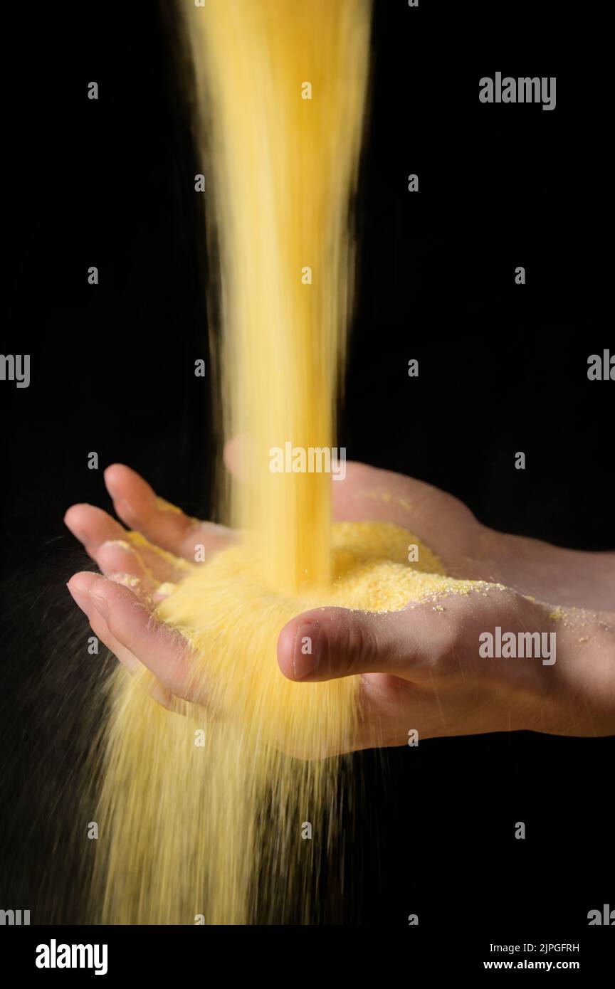 Abstract Farmer Sprinkles Corn Flour Dust Powder Through Hands Stock Photo