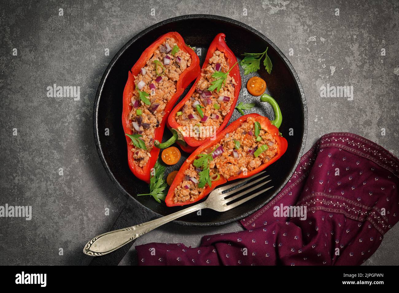 Red Bell Stuffed with Minced Meat and Vegetables in Pan Stock Photo