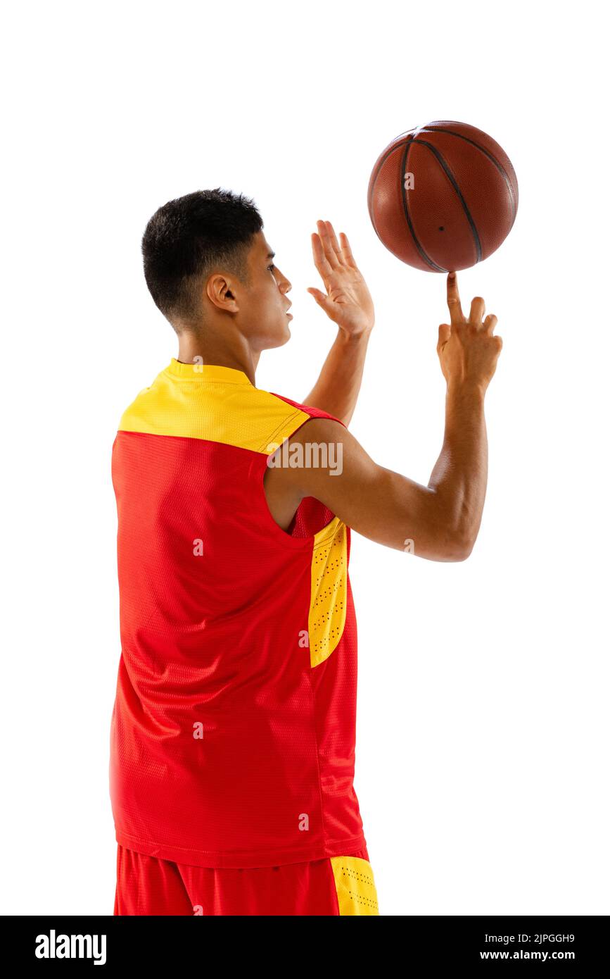 basketball player spinning on finger ball and looking at camera Isolated On  White Stock Photo - Alamy