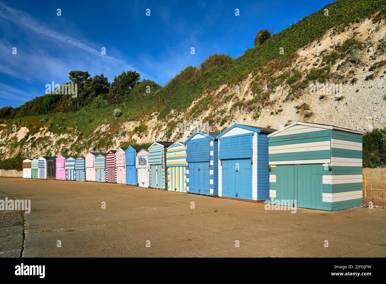 Colorful wooden beach huts at Dumpton Gap beach in Kent, UK