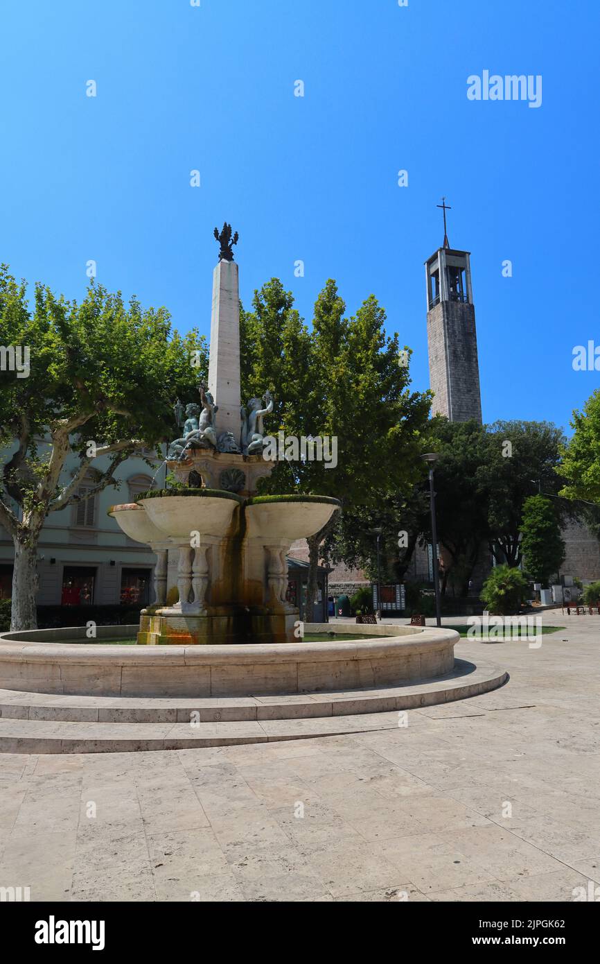 A Fountain and a Modern Church Spire in the center of Montecatini Terme, Tuscany, Italy. Stock Photo