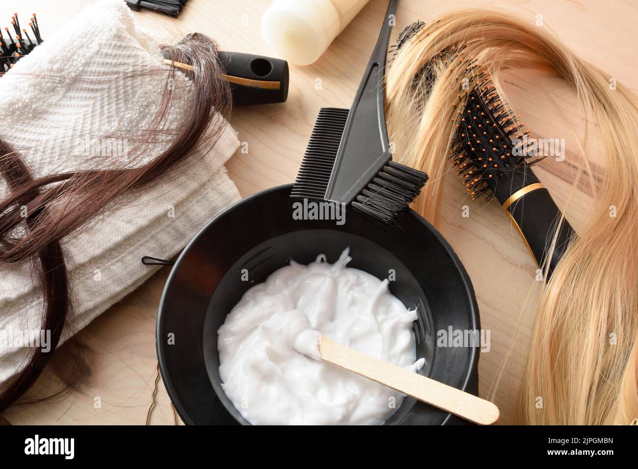 Detail of set of hair treatment products on wooden table. Top view. Horizontal composition. Stock Photo