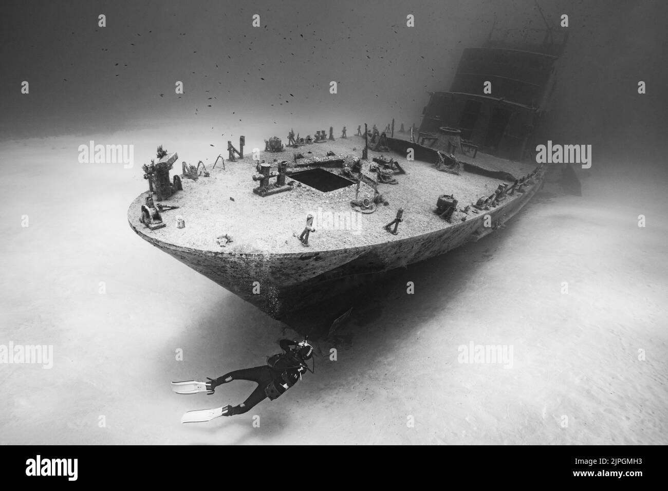 Diving on P31, a sunken underwater ship wreck in Gozo, Malta with diver in picture. Stock Photo