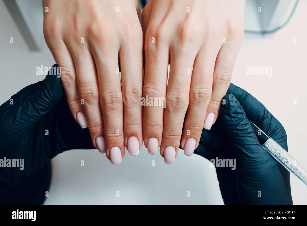 Manicure process female hands finger nails polish checking Stock Photo