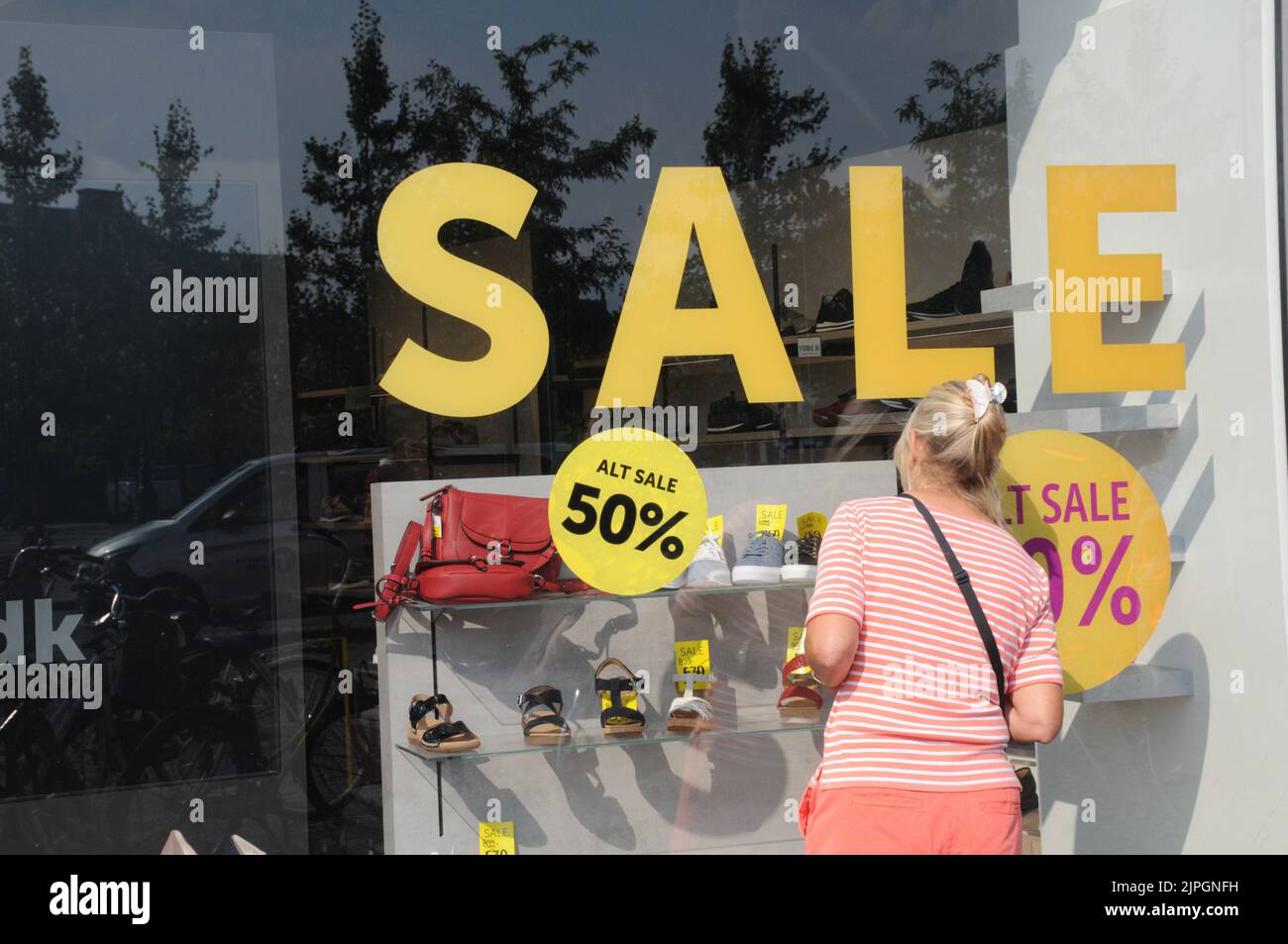Copenhagen /Denmark/18 August 2022/Window shoppers stody 50 discount