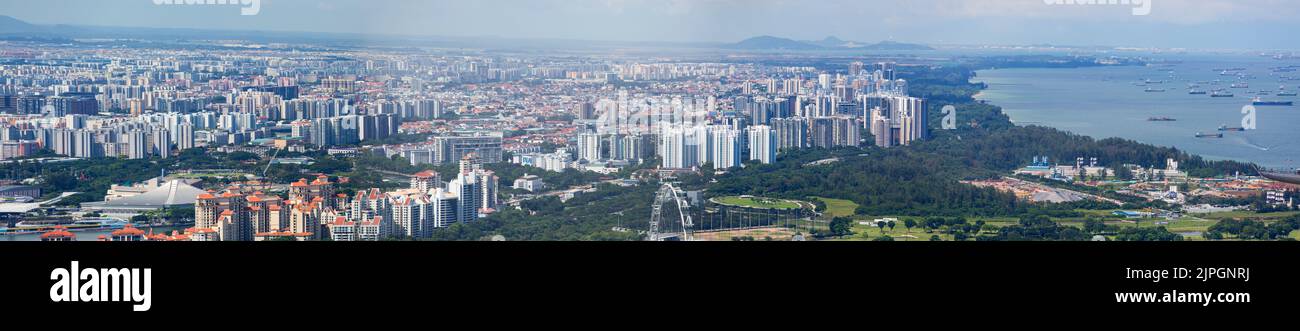 Panoramic skyline view of eastern part of Singapore island on a clear day. Stock Photo