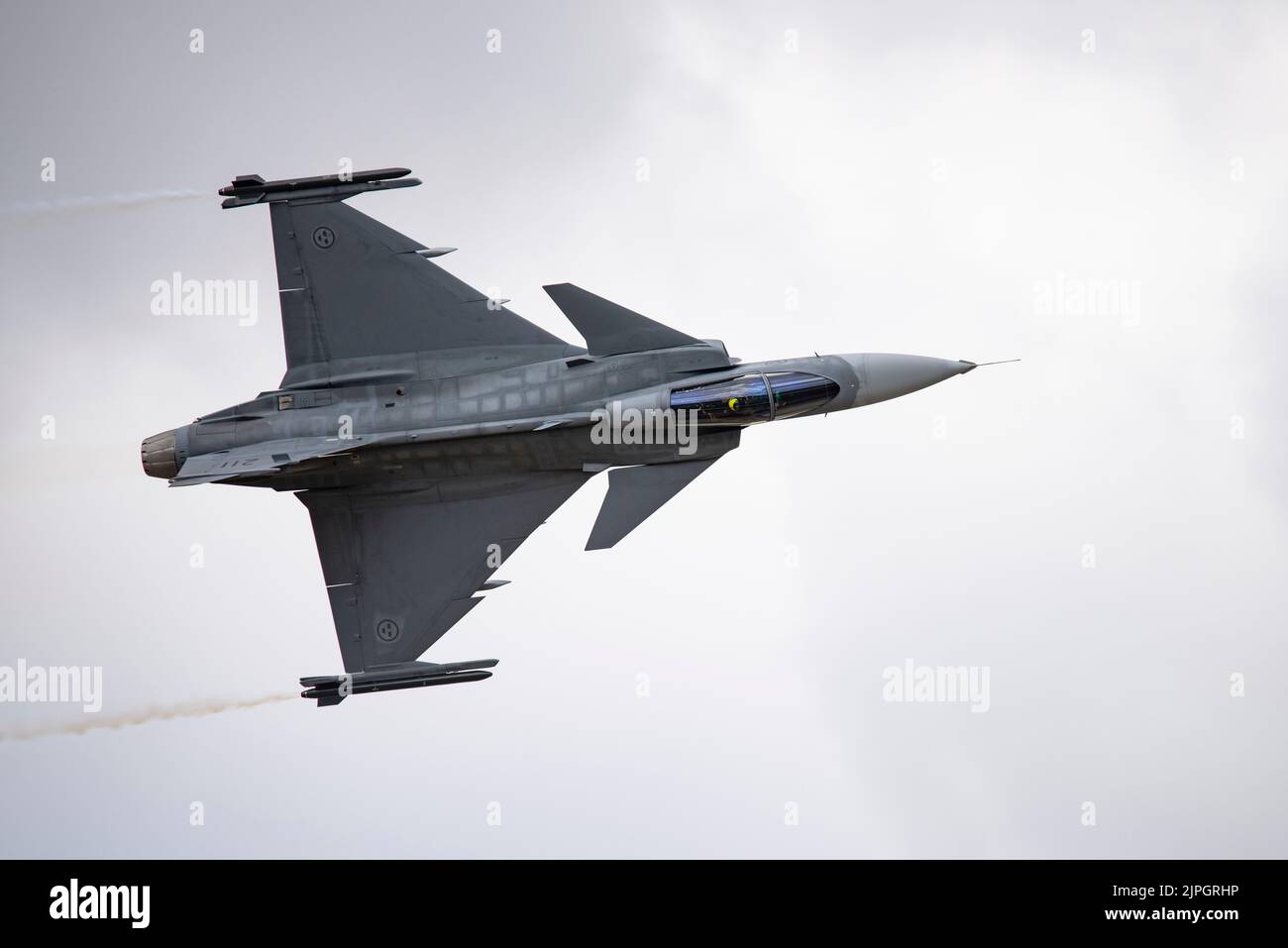 A superb flying display by the Hungarian Air Force demonstrates the airborne agility of the Swedish Gripen JAS 39C multirole fighter jet at the RIAT Stock Photo