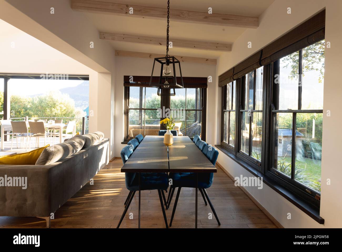 General view of luxury interior of dining room with table and chairs ...