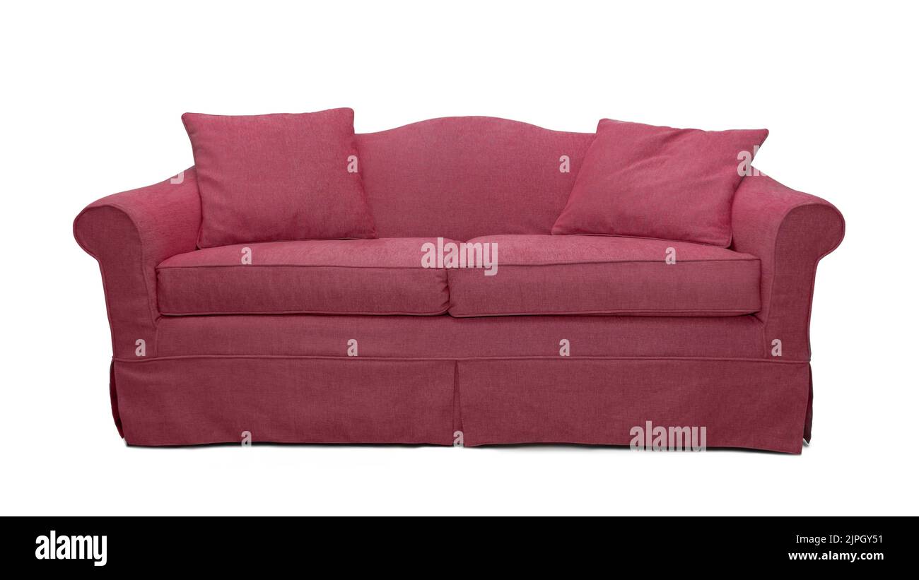 Pink sofa with two pillows isolated on white background. Pink classic style couch with upholstery cover Stock Photo