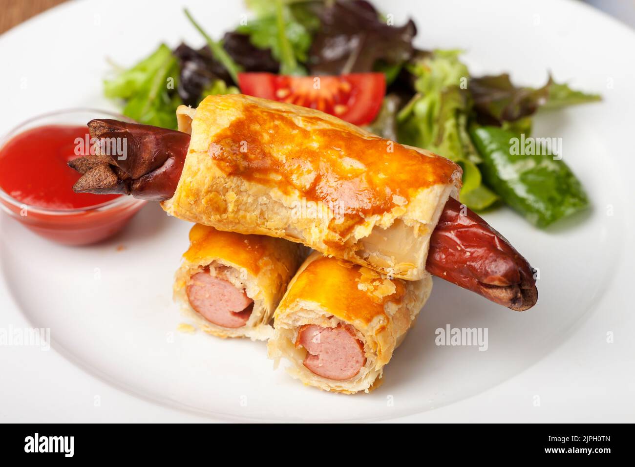 pigs in a blanket, sausage rolls, pigs in a blankets, sausage roll Stock Photo Alamy