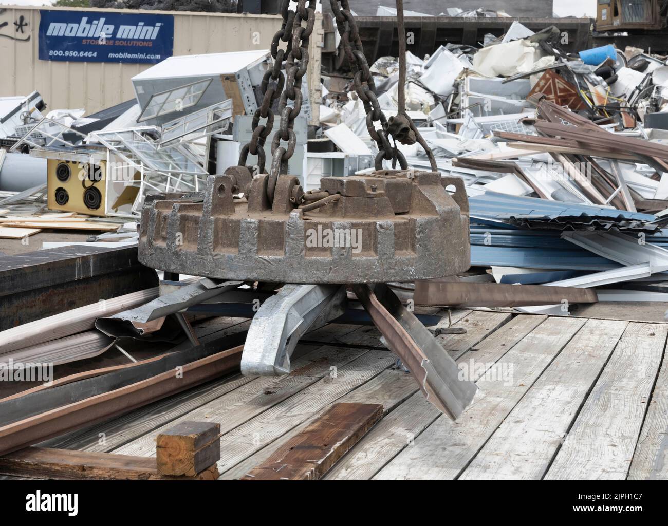 A large Caterpillar track material handler with an attached