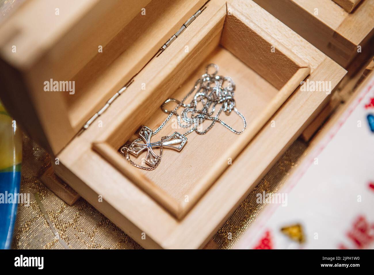 a cross in a box in a church during baptism Stock Photo Alamy