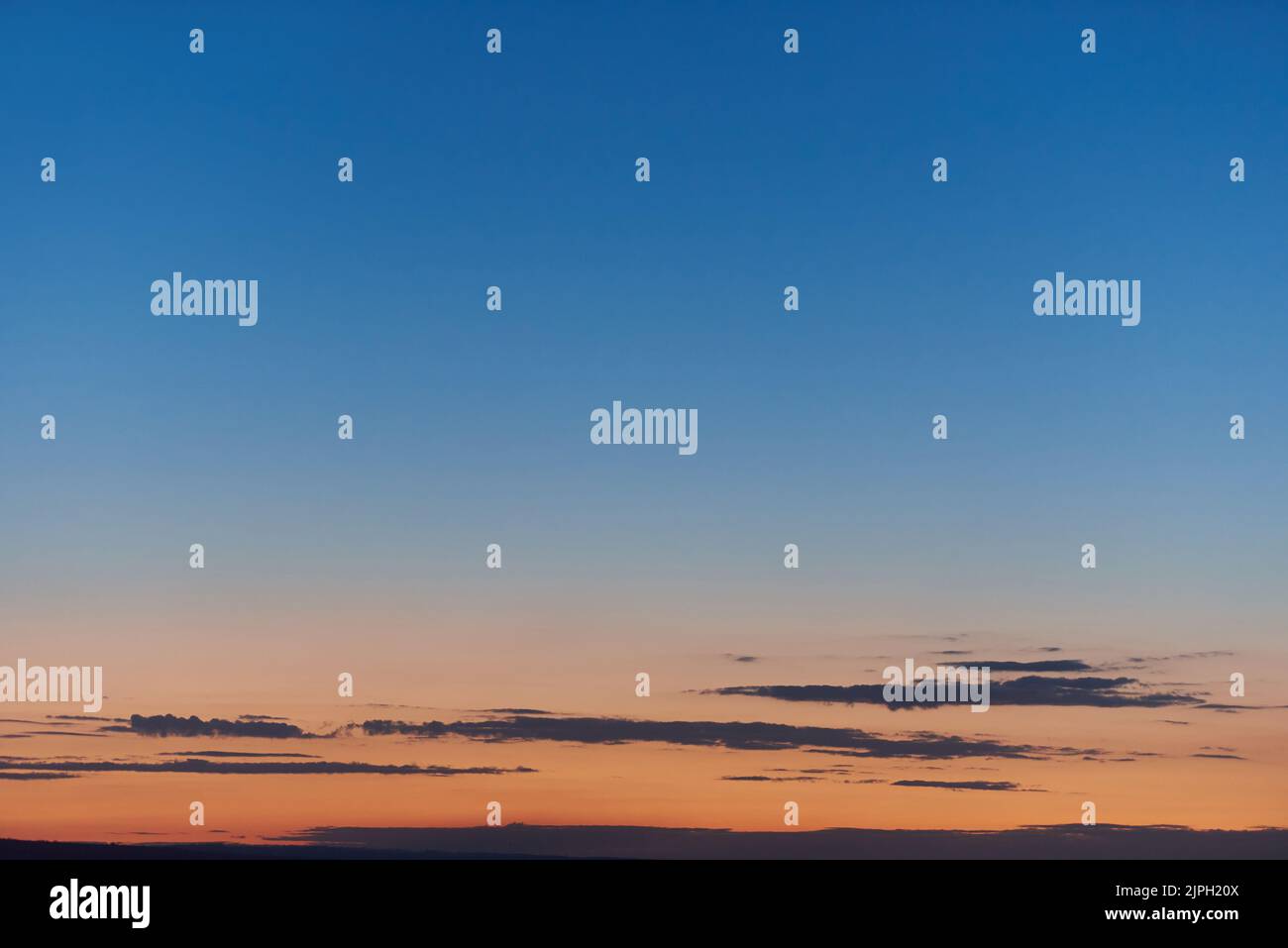 Beautiful evening sky with orange sunset Stock Photo