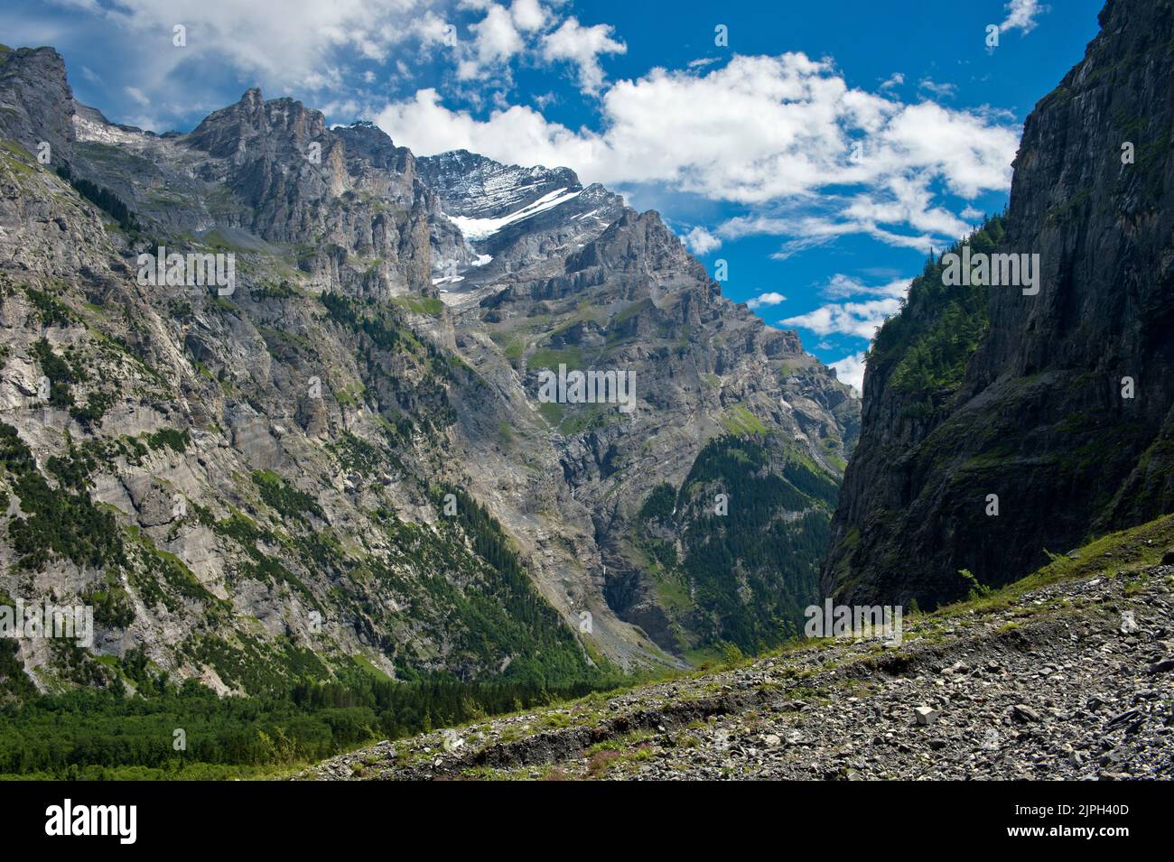 The steep cliff face of the Doldenhorn mountain range rises above the Gastern Valley, Kandersteg, Bernese Oberland, Canton of Bern, Switzerland Stock Photo