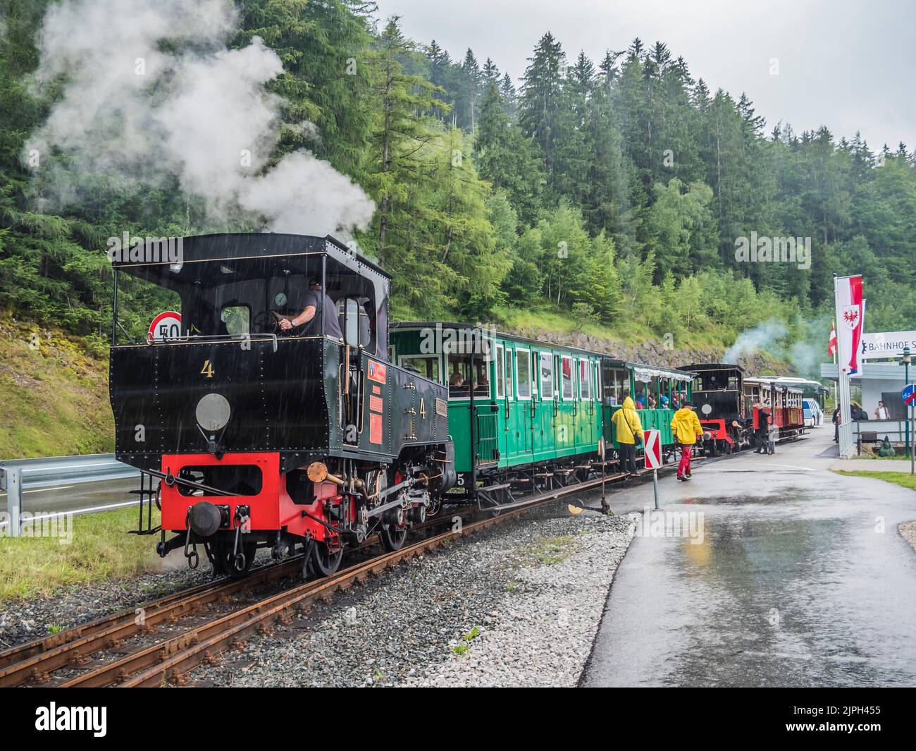 This is the famous cog railway steam train with its vintage carriages tourist attraction that operates from Jenbach to the scenic lake Achensee Stock Photo