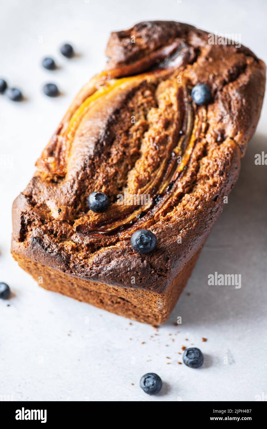 Banana bread with blueberries on a gray background. Stock Photo