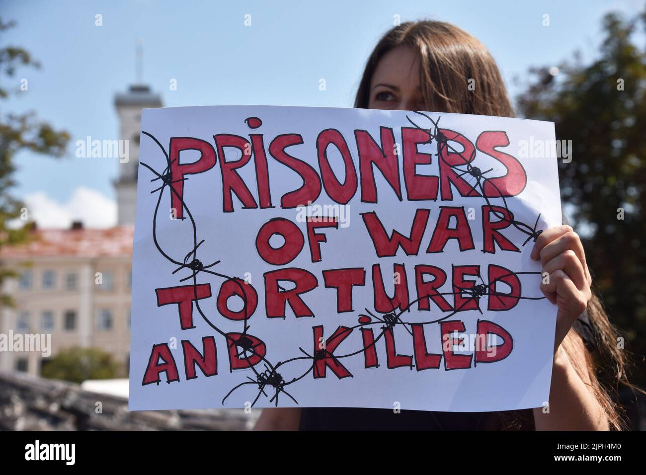 Lviv, Ukraine. 18th Aug, 2022. A protester holds a placard calling for the release of captured soldiers during the demonstration. Relatives of the Azov Regiment stage a demonstration calling for the release of captured soldiers of the Azov Regiment during the visit of Ukrainian President Volodymyr Zelenskyi, Turkish President Recep Erdogan and UN Secretary General António Guterres to Lviv. Credit: SOPA Images Limited/Alamy Live News Stock Photo