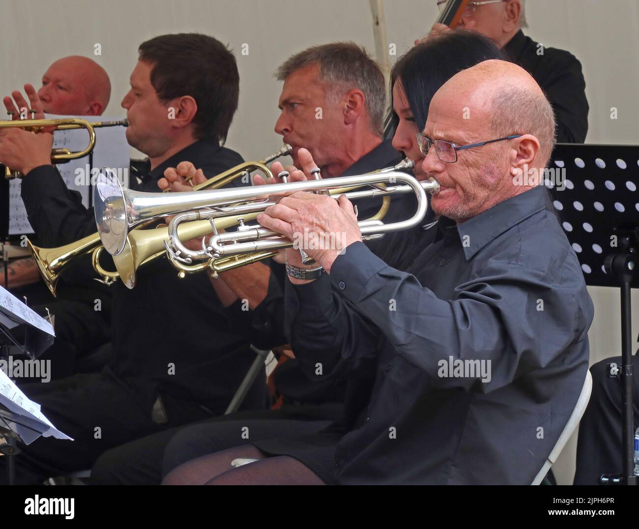 Cornet and brass section players at The Hereford Big Band, playing live, at the three choirs festival 2022 Stock Photo