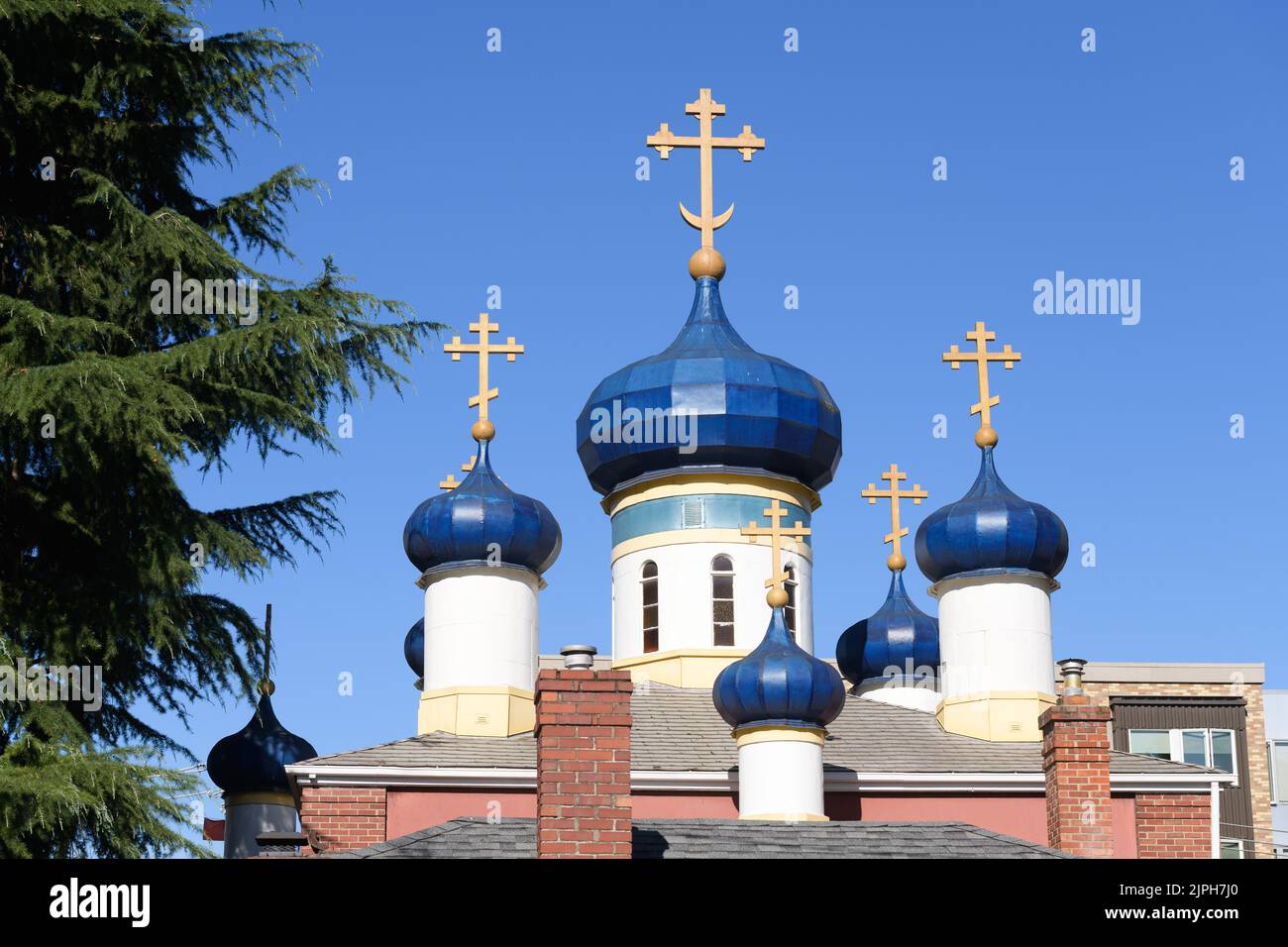 Seattle - August 14, 2022; Classic blue onion domes of Saint Spiridon Orthodox Cathedral in Seattle Stock Photo