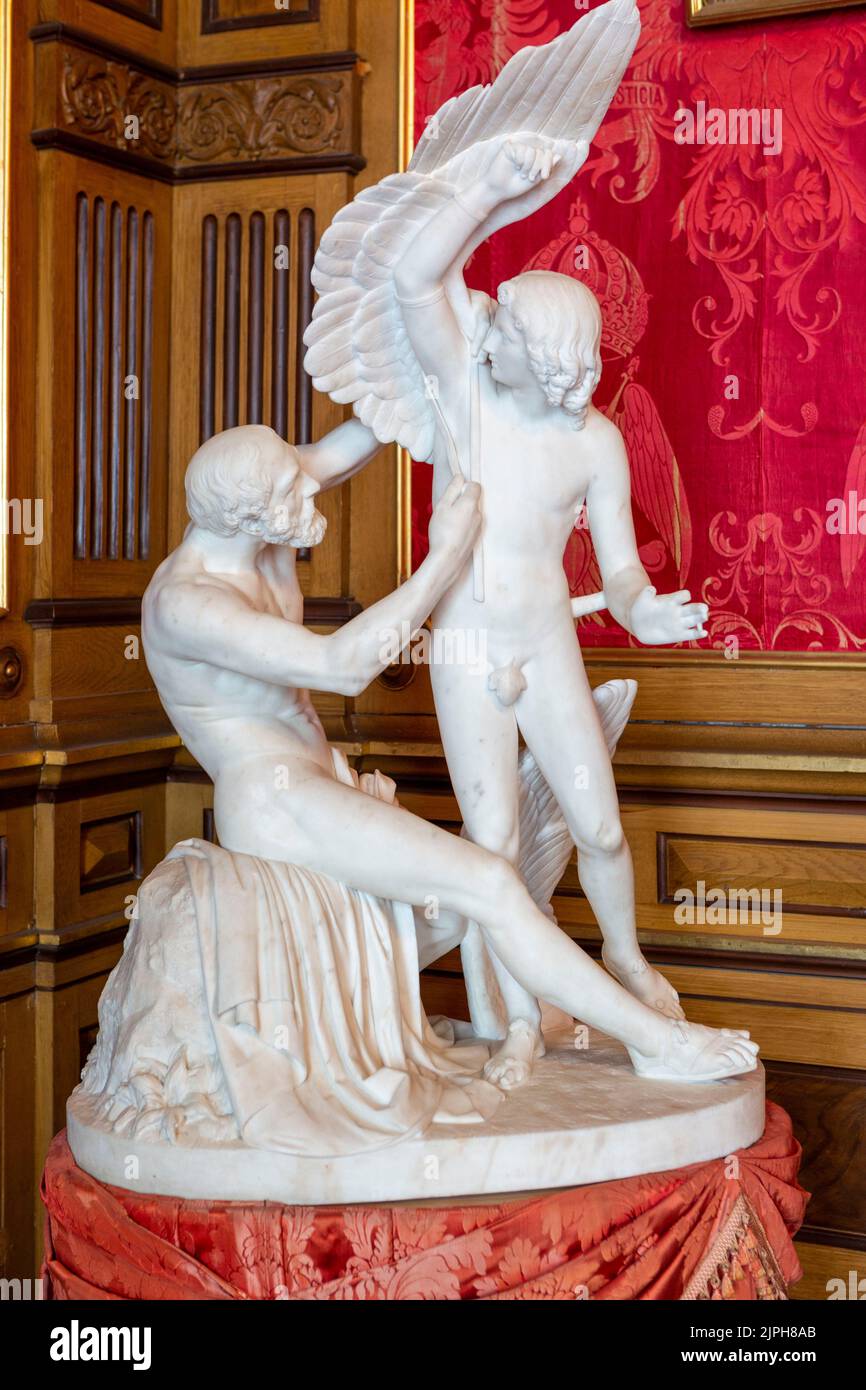 Castle Miramare. Statue of Daedalus attaches wings to Icarus Stock Photo