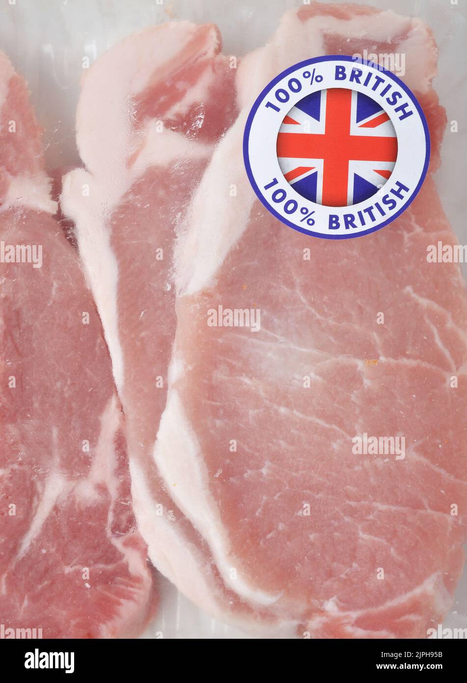 Close up of British Pork Loin Steaks in packaging with 100% British sticker attached Stock Photo